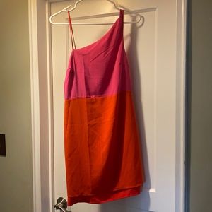 Cute summer cocktail dress.  Orange and pink adjustable single strap.  Lined.
